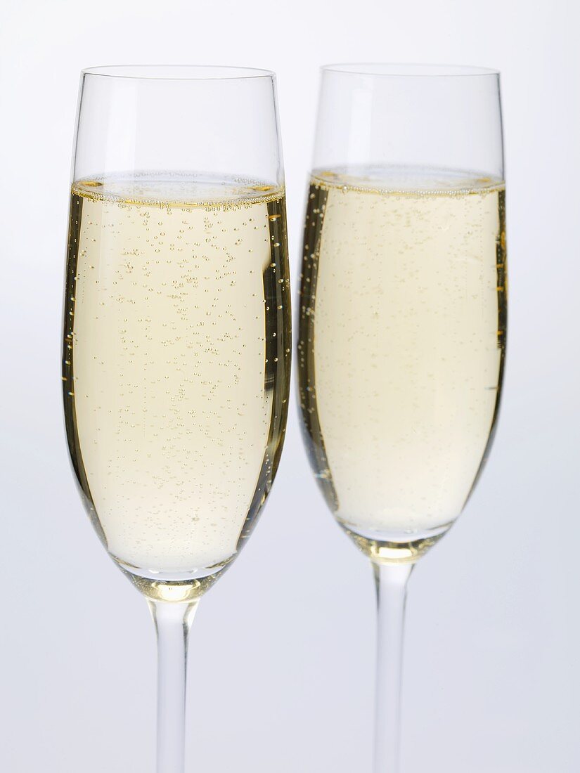 Two glasses of sparkling wine side by side