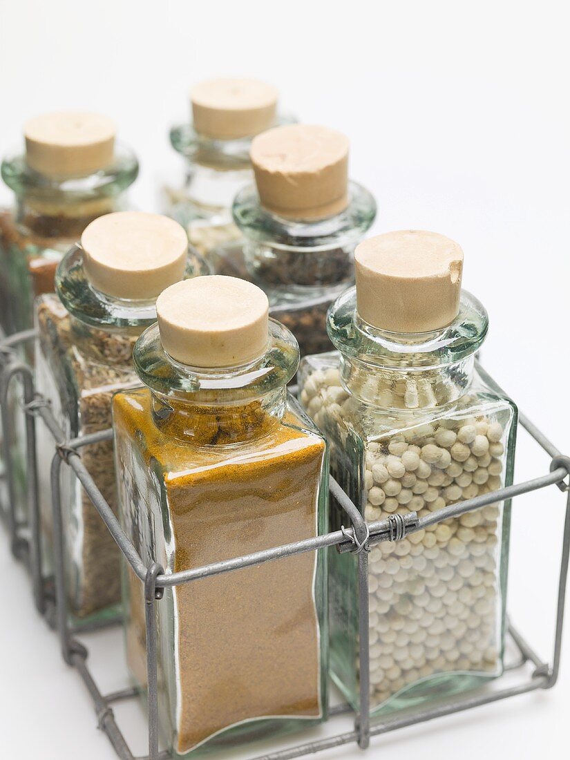 Various spices in small glass bottles