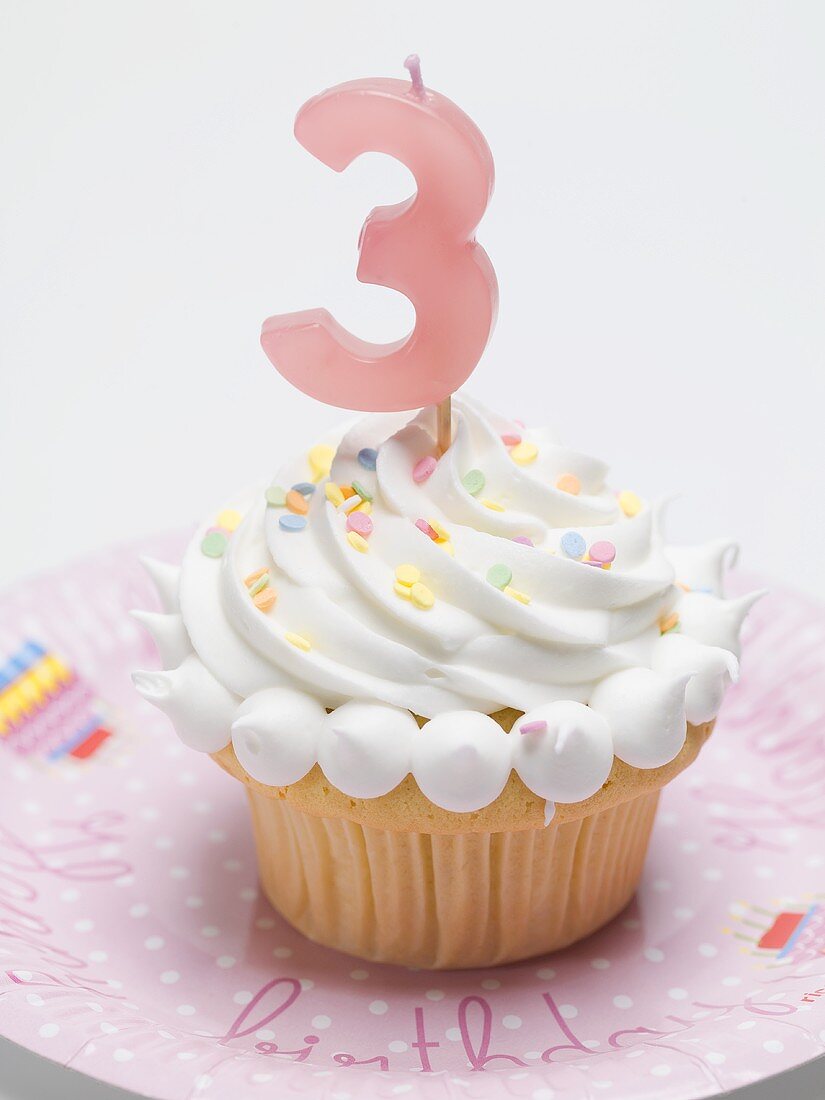 Birthday muffin with meringue topping and candle