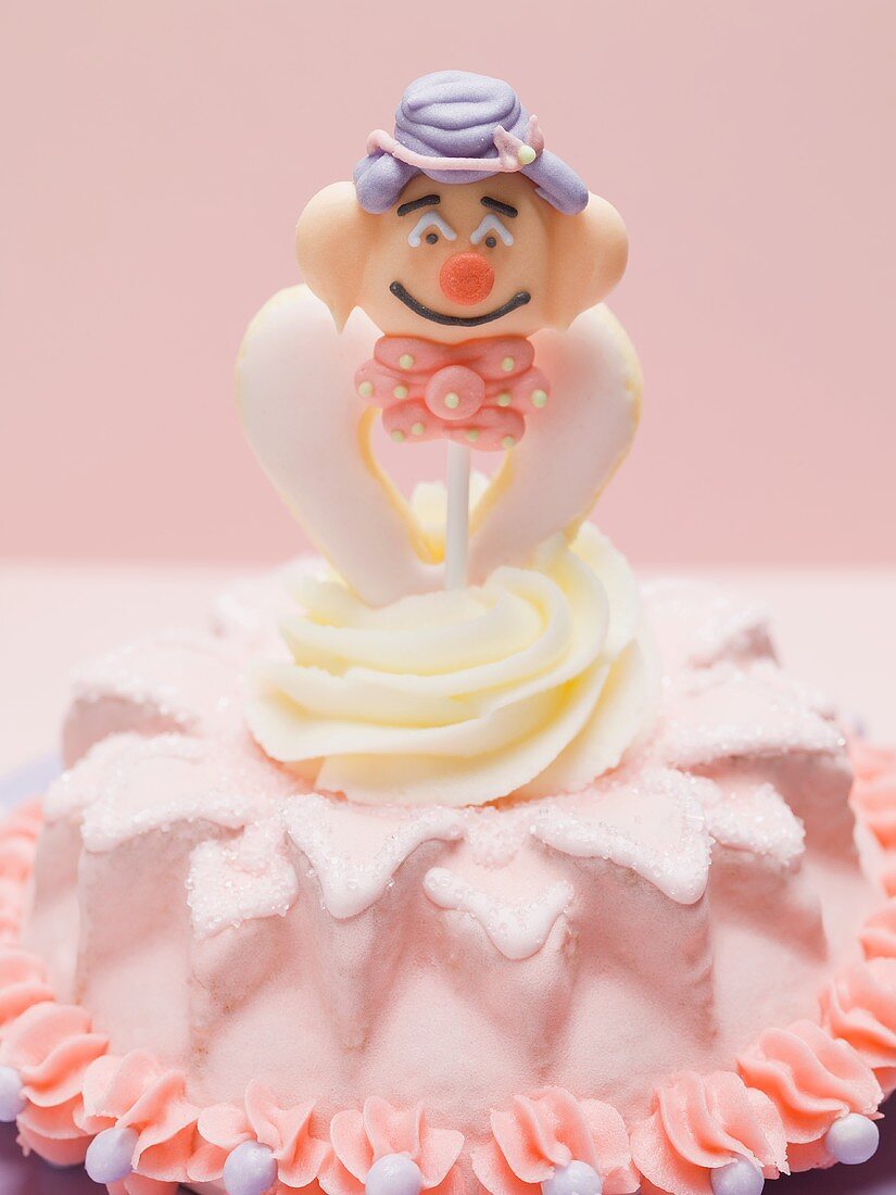 Small cake with clown figure for children