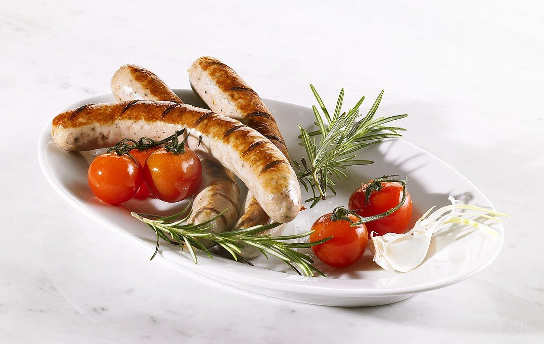 Grilled sausages with fresh tomatoes and rosemary