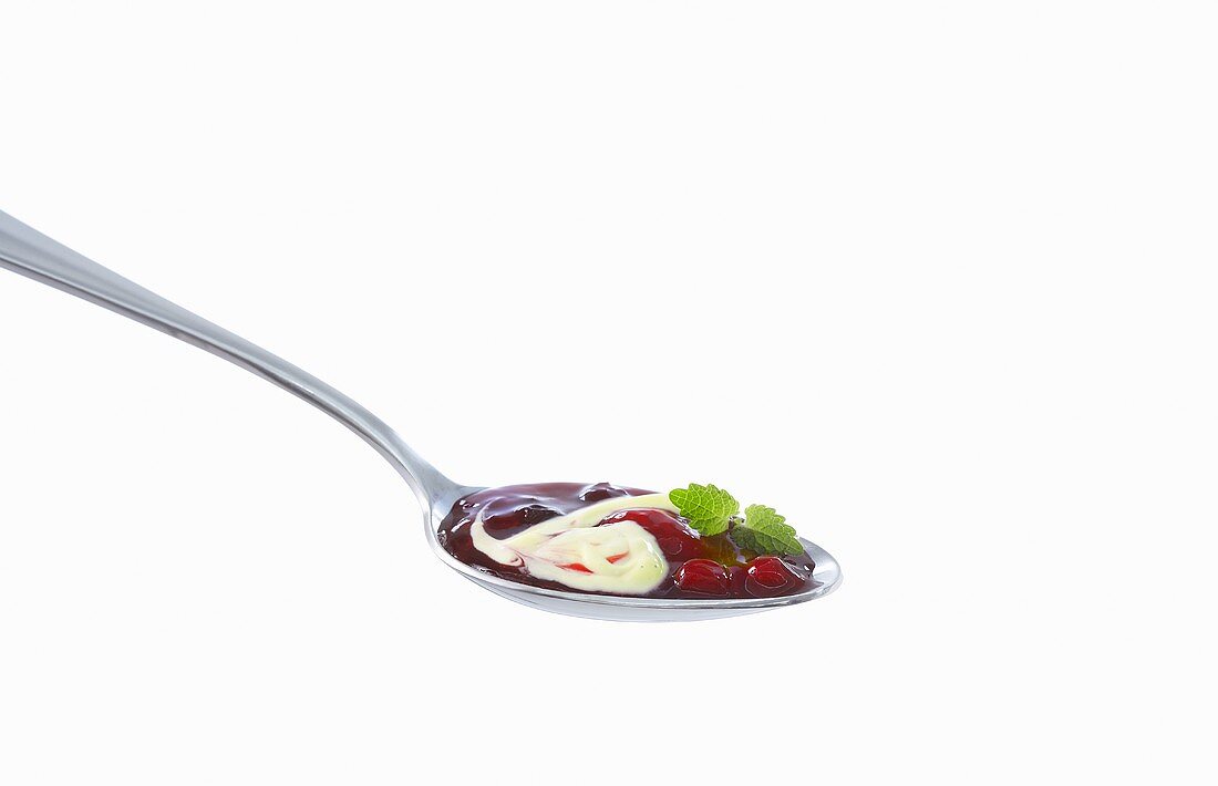 A spoonful of red fruit compote