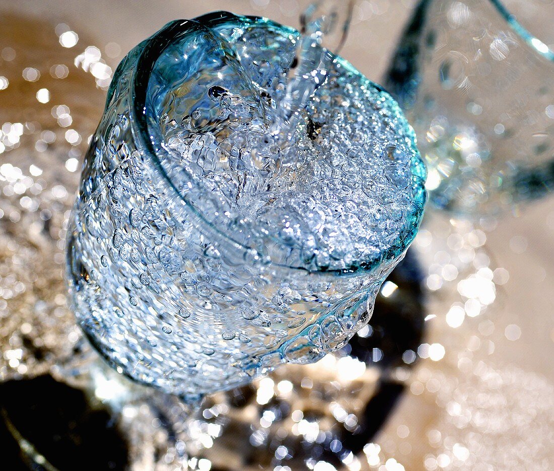 Pouring water into a glass