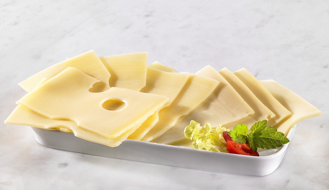 Several slices of Emmental cheese