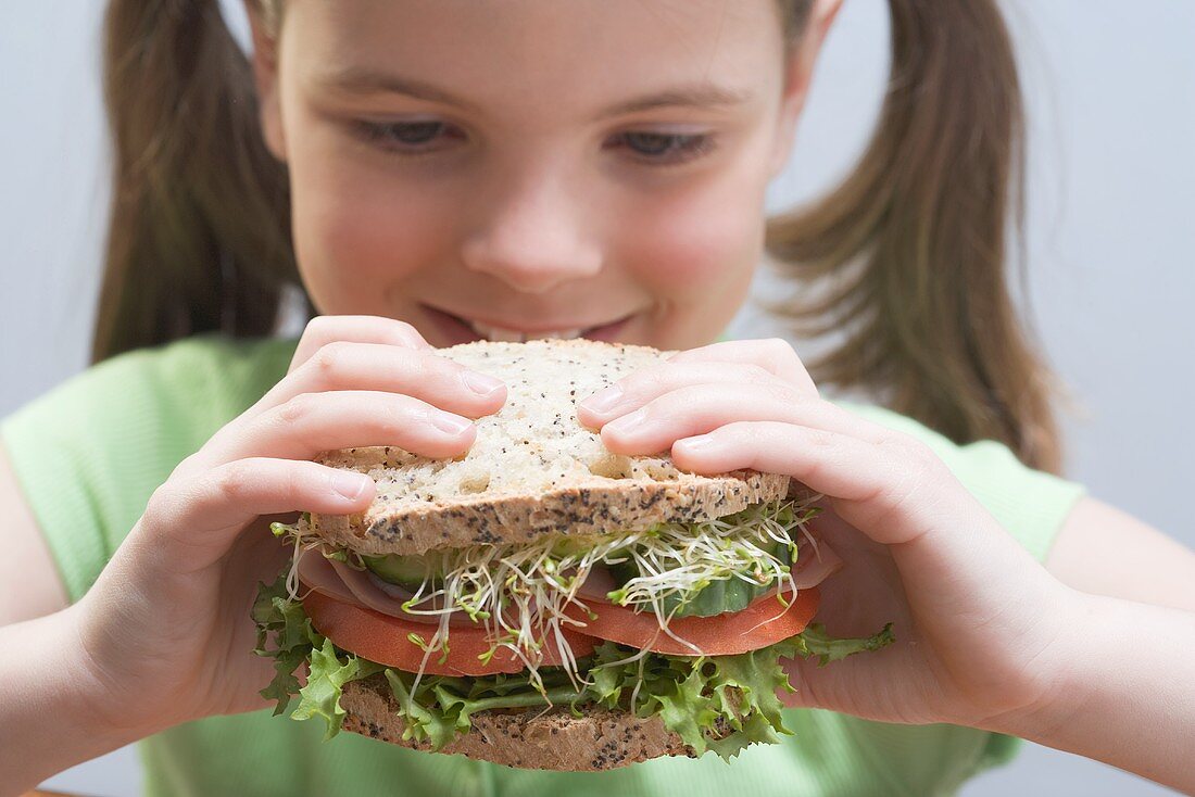 Girl with large sandwich