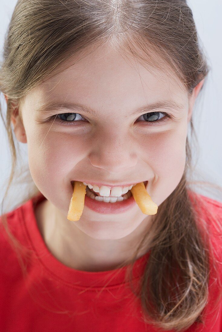 Mischievous girl with chip fangs