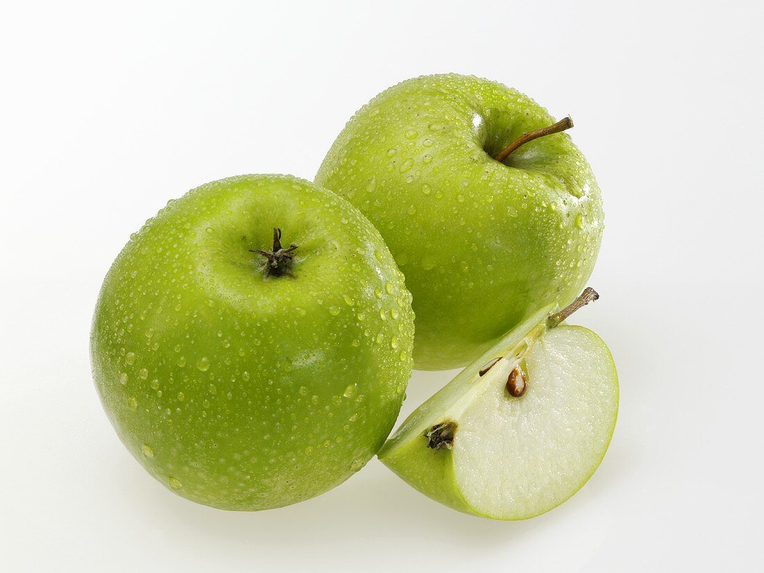 Granny Smith apples with drops of water