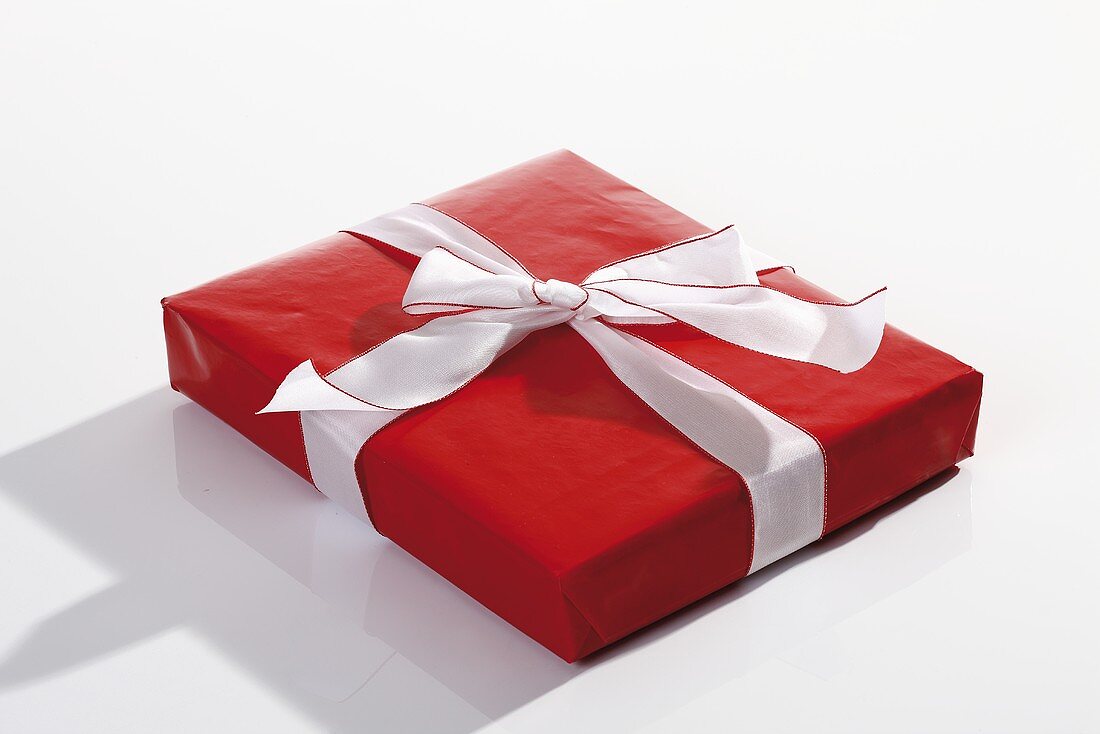 Red parcel with white ribbon
