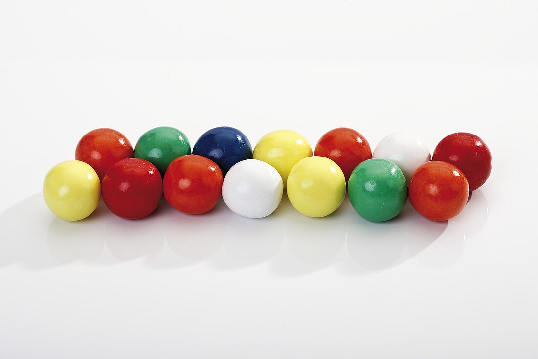 Coloured bubble gum balls in a row