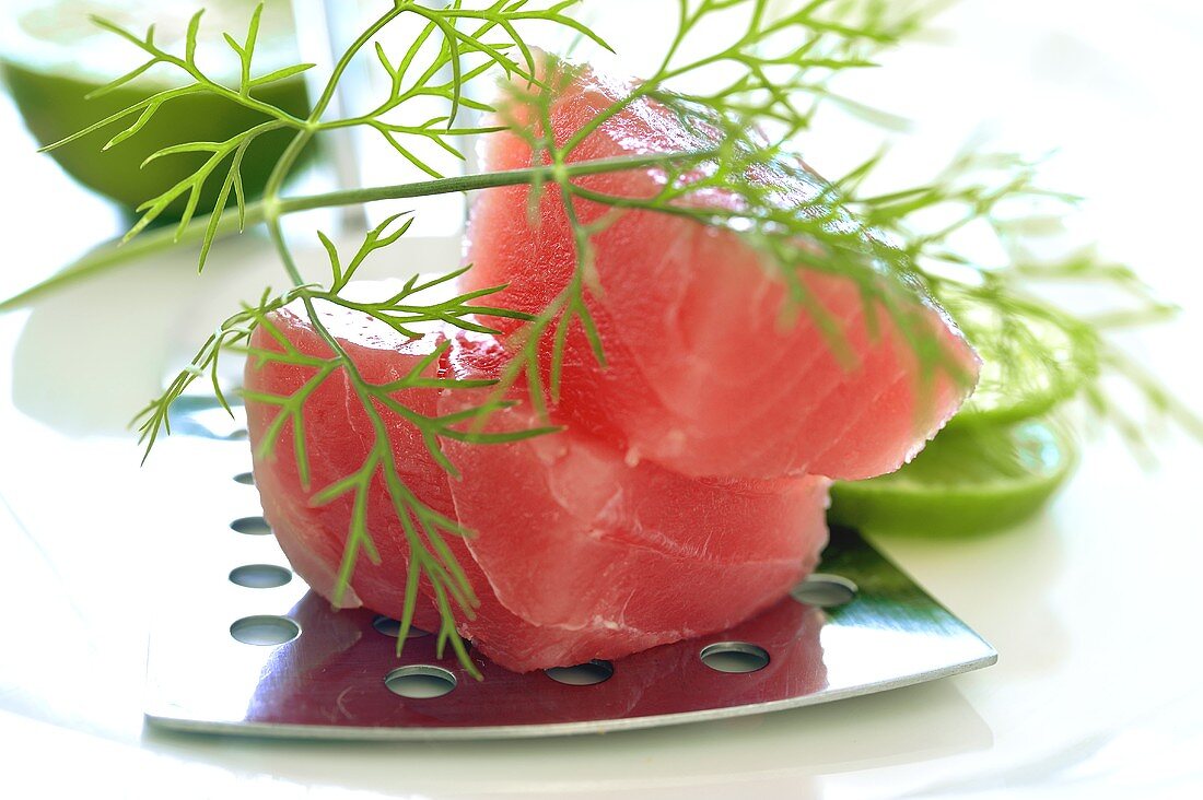 Fresh tuna fillet with slices of lime