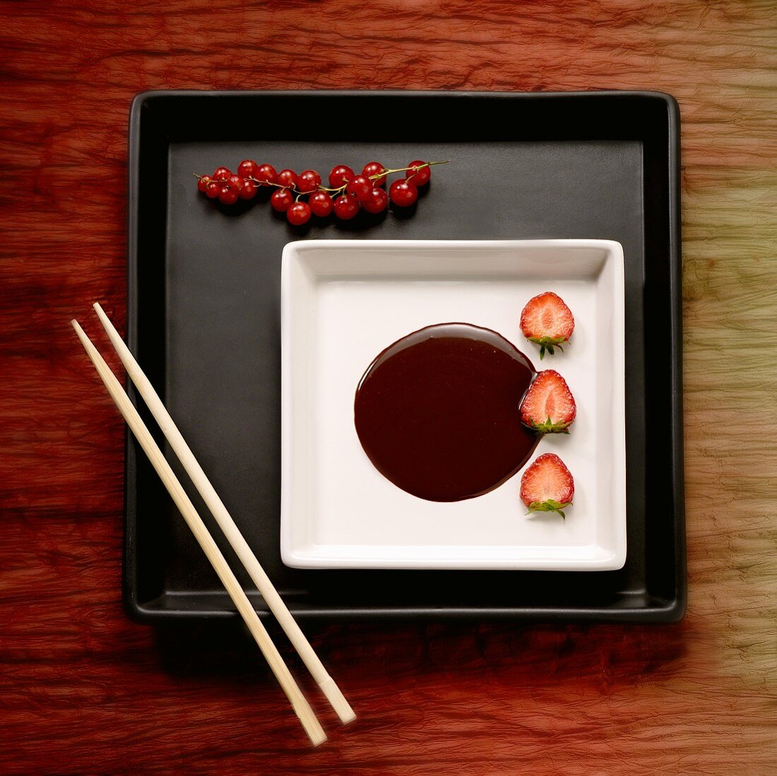 Chocolate fondue with strawberries and redcurrants