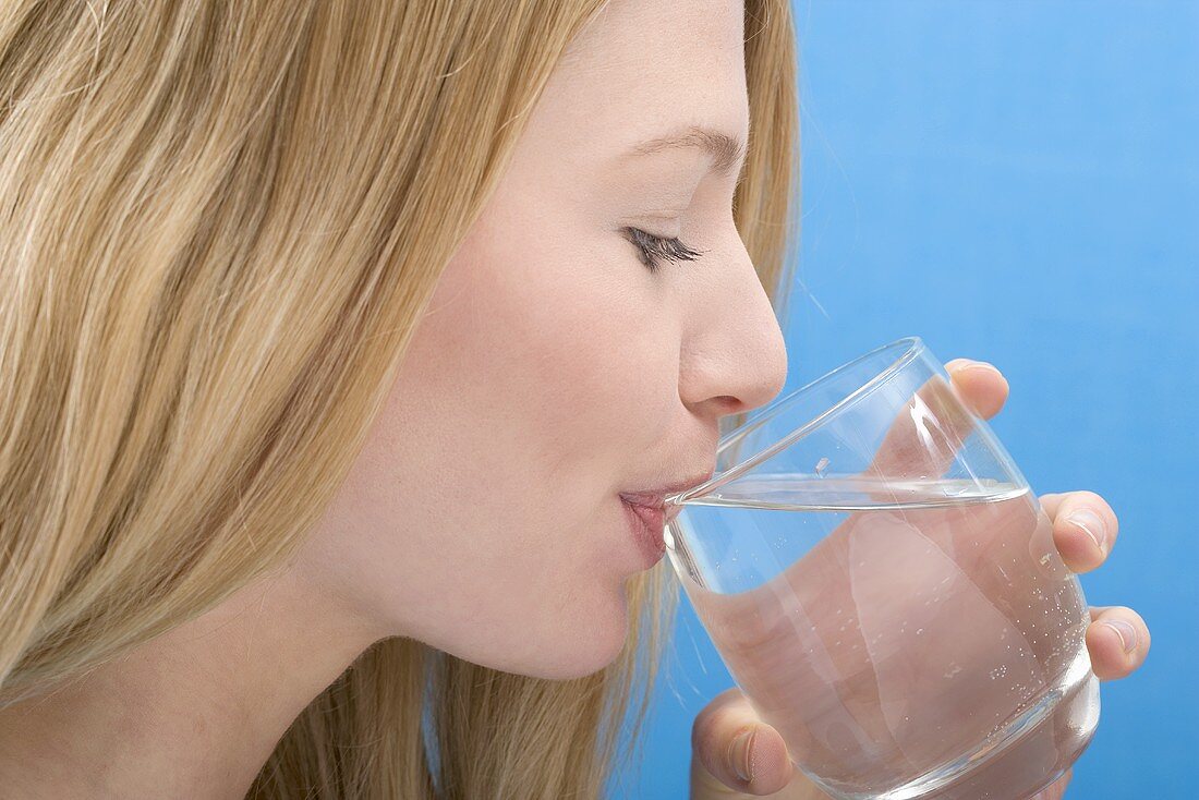 Woman drinking glass of water