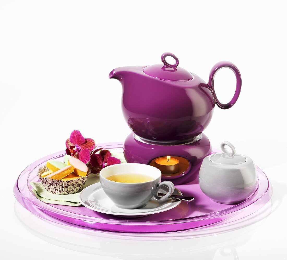Tea scene with purple teapot and warmer