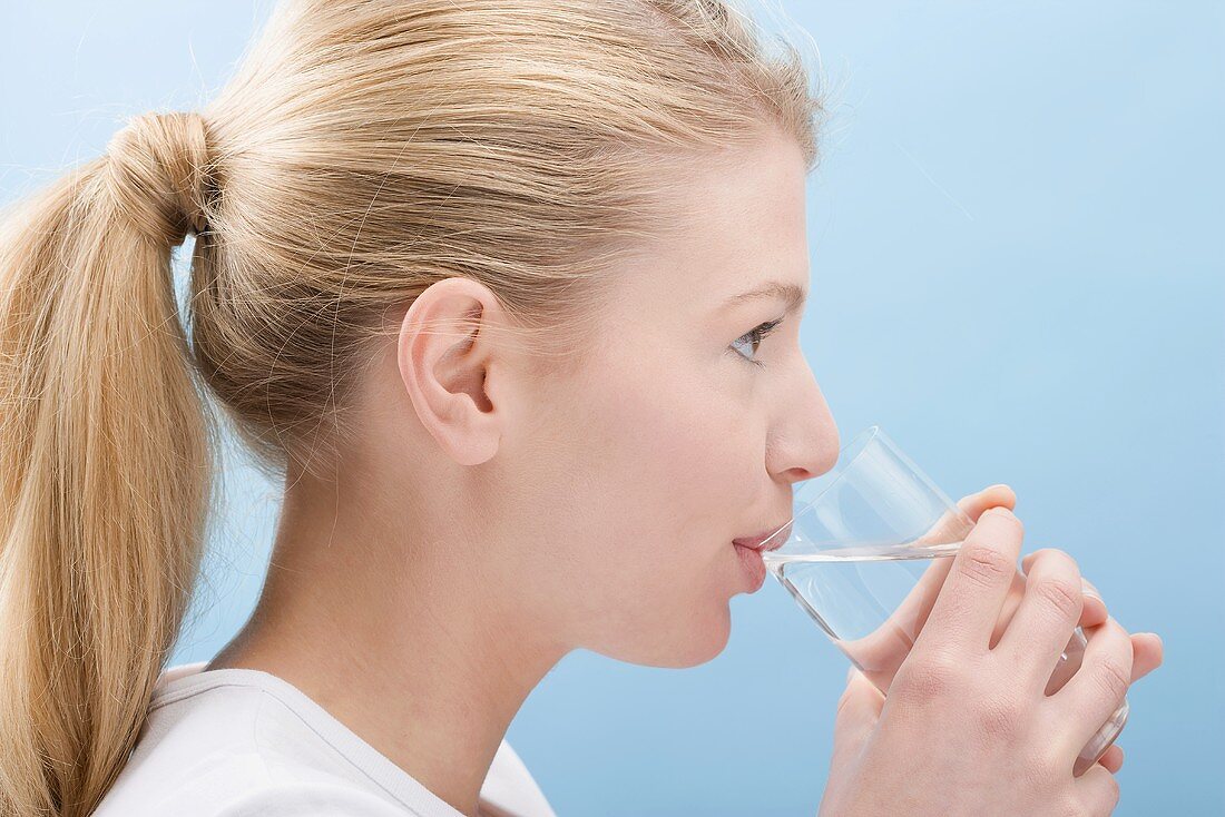 Woman drinking glass of water