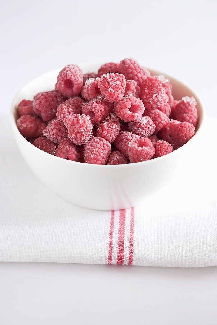Frozen raspberries in bowl