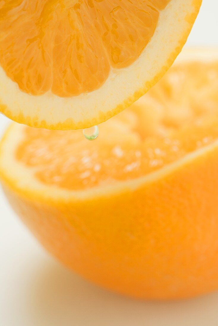 Orange with a drop (close-up)