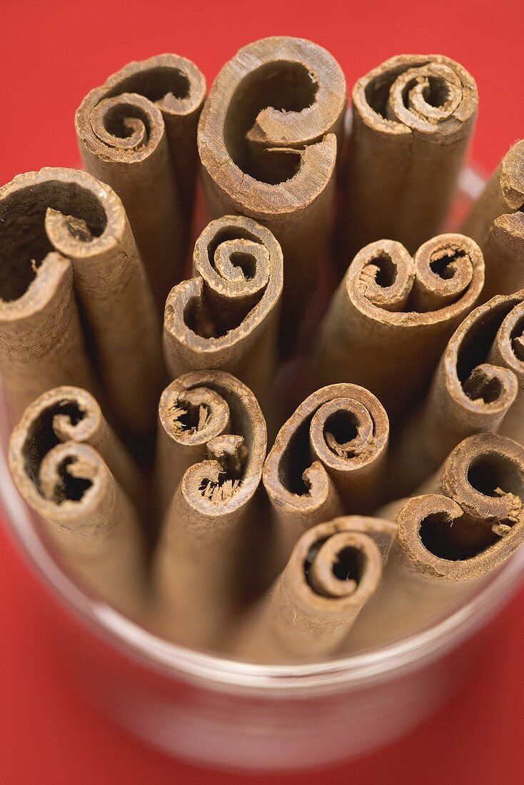 Several cinnamon sticks in glass (close-up)