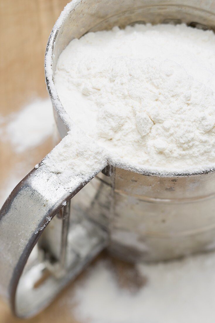 Flour in flour sifter (close-up)