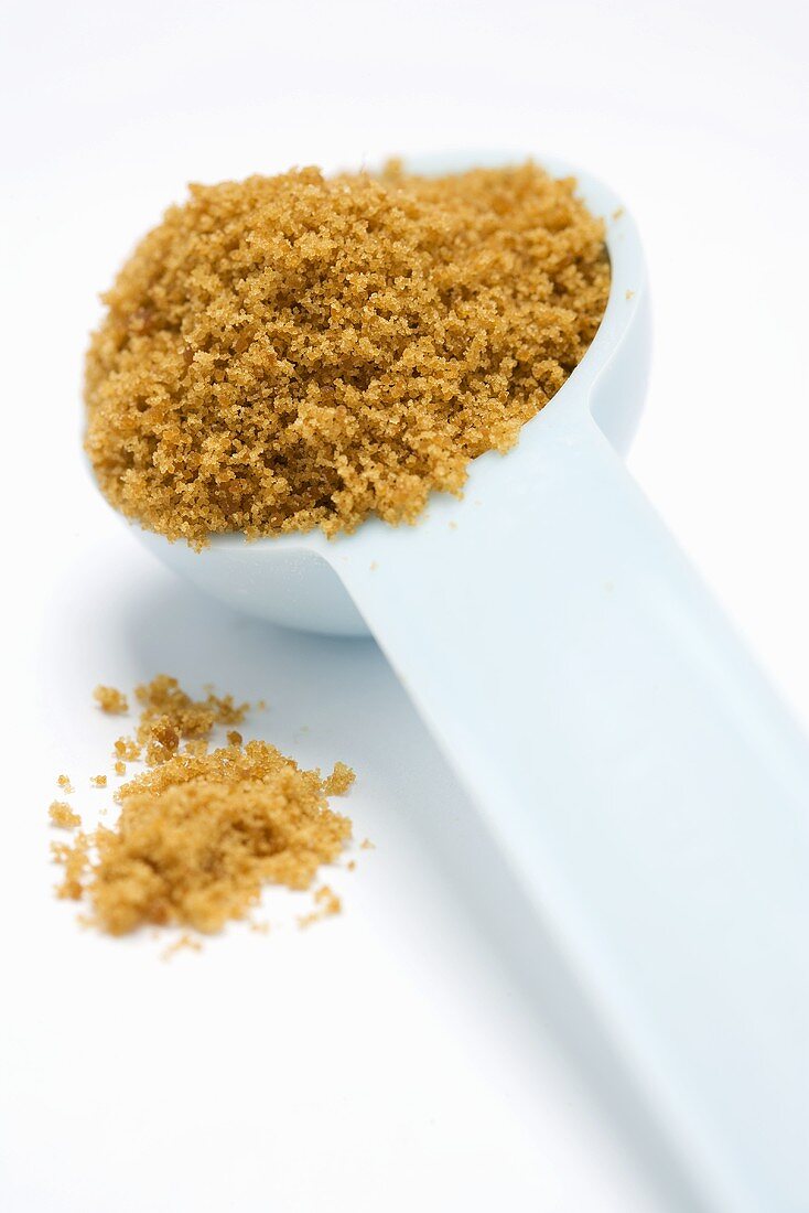 Measuring Cup Packed with Brown Sugar