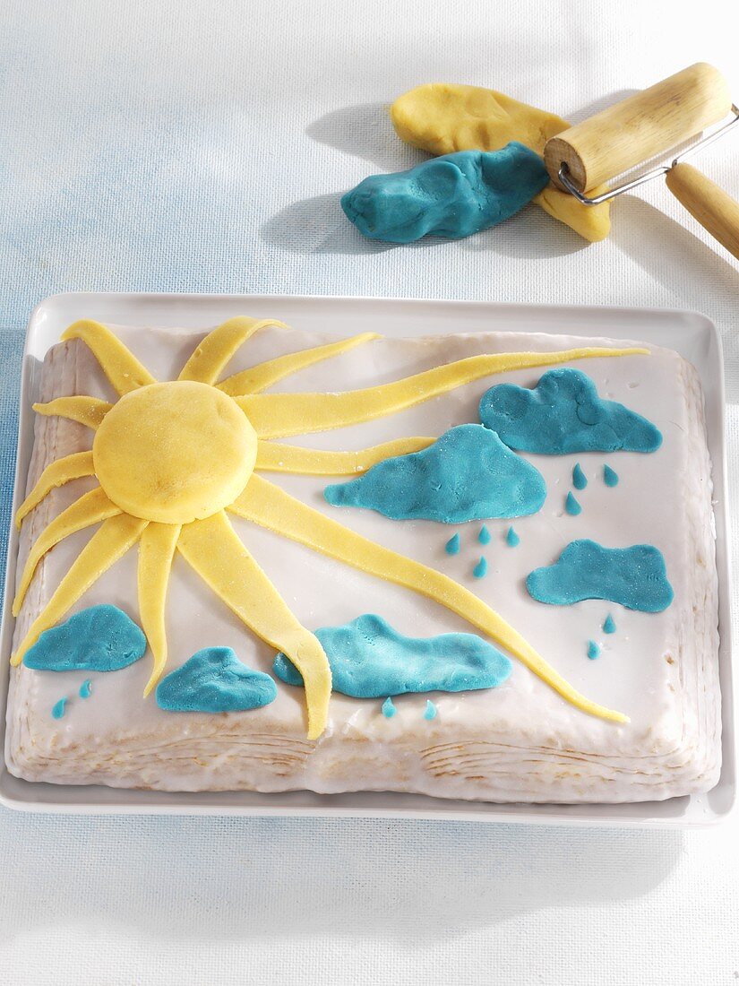 Sunshine and showers cake with marzipan decorations