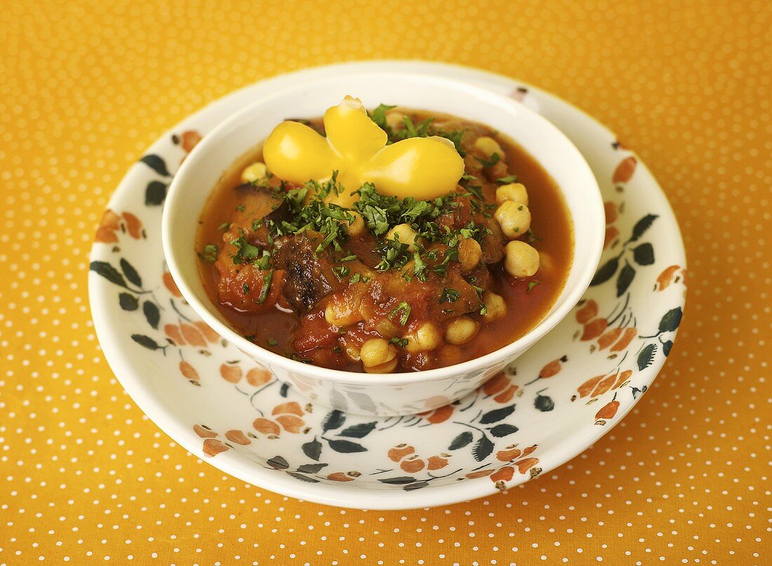 Chick-pea stew with potatoes in soup bowl