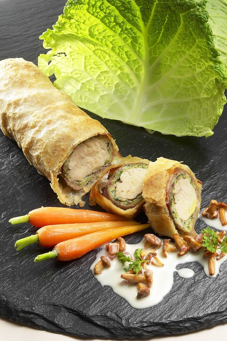 Guinea fowl strudel with carrots and chanterelle sauce