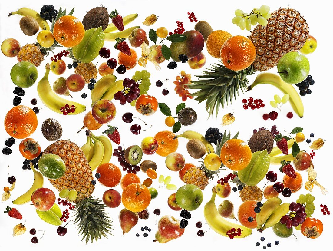 Many different types of fruit against white background