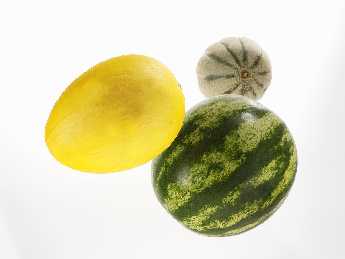 Whole watermelon, honeydew melon and Charentais melon