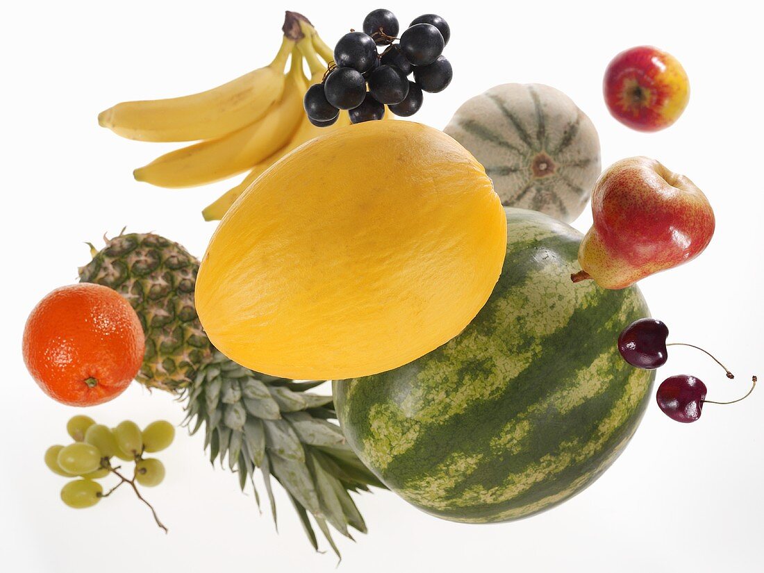 Various types of fruit against white background