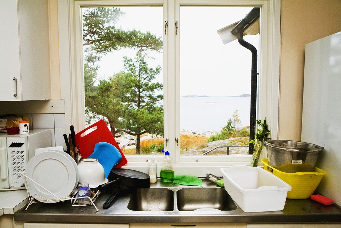 Sink with draining rack by window