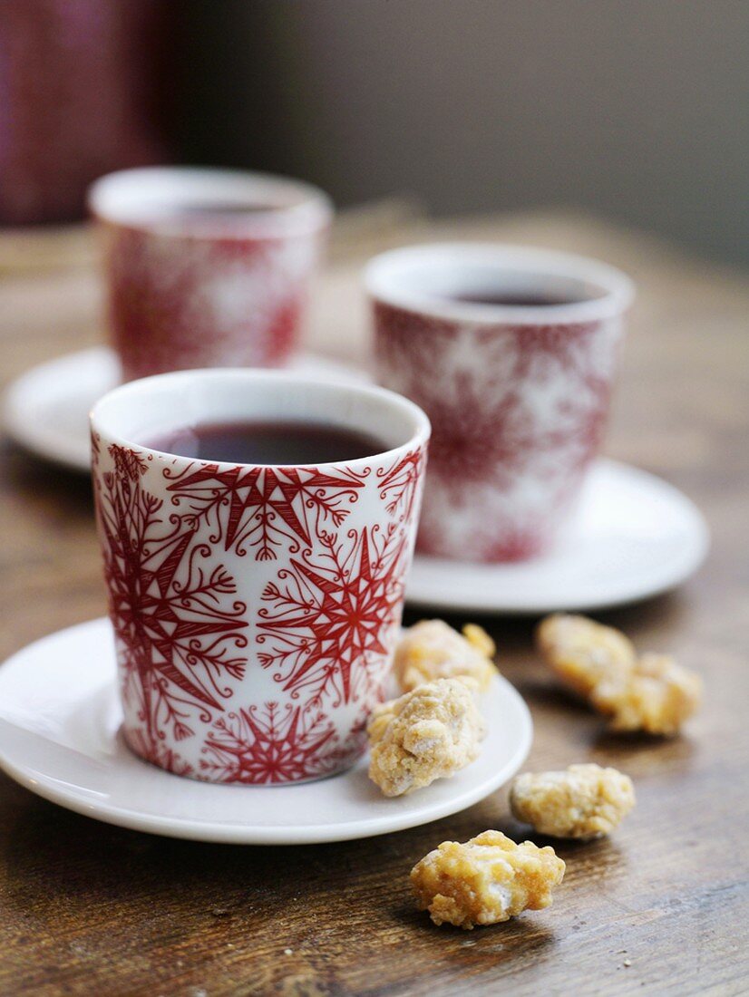 Three cups of mulled wine and biscuits