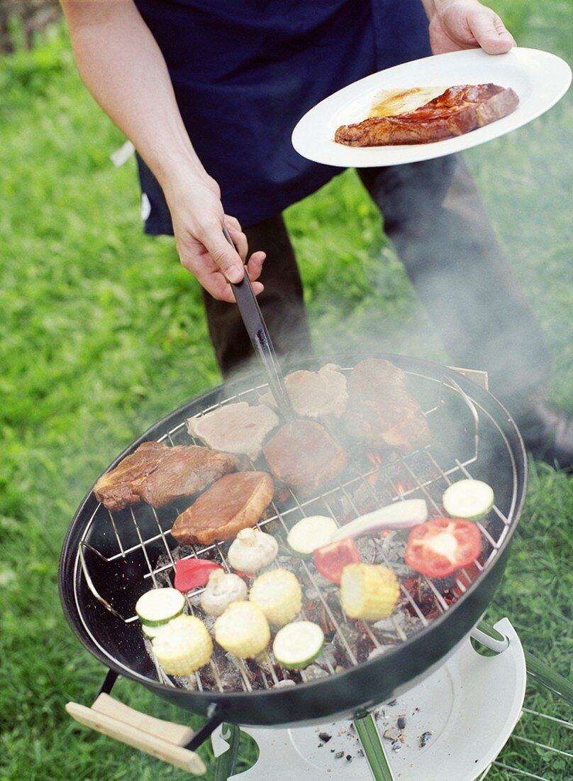 Person barbecuing food