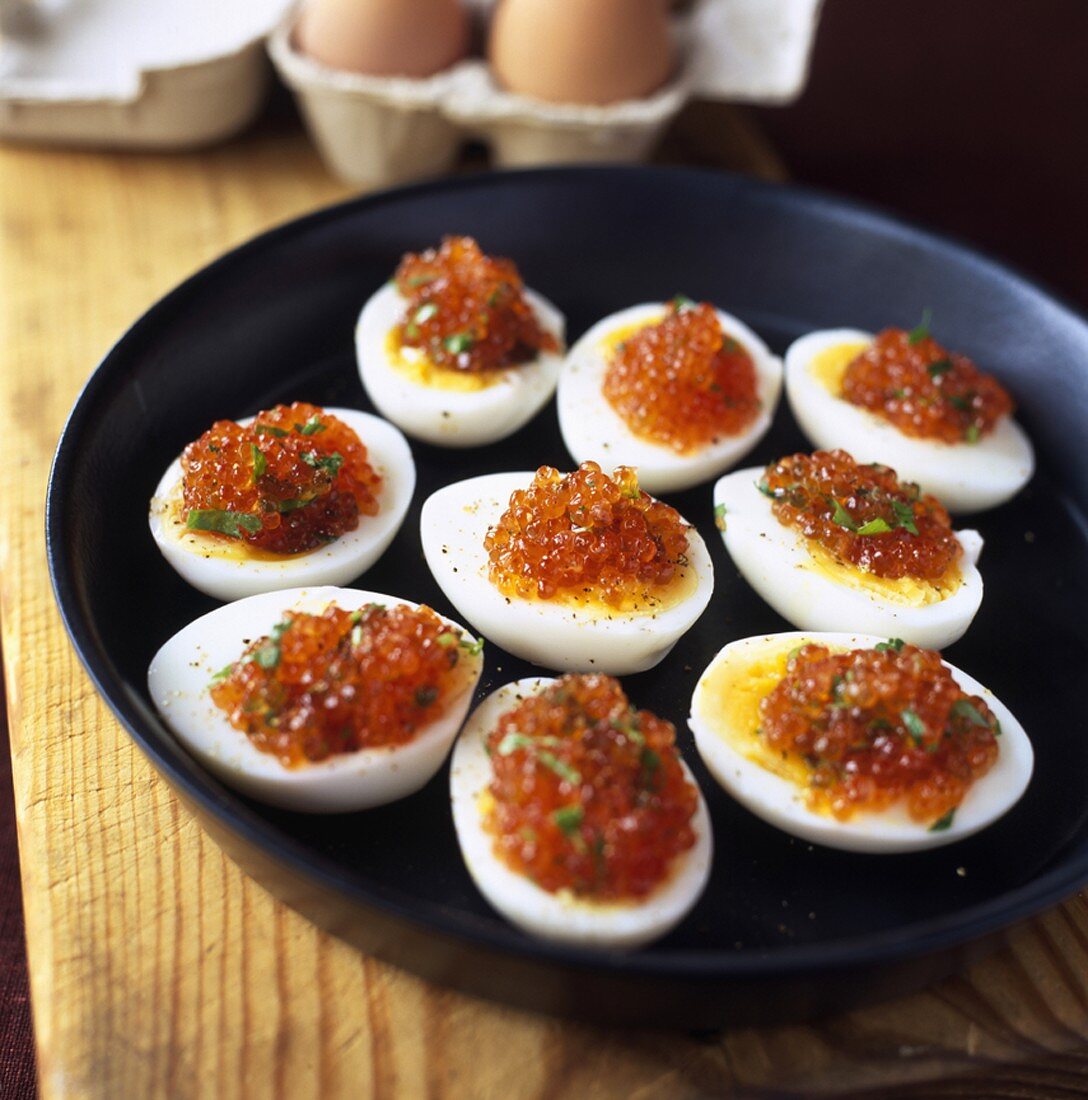 Boiled egg halves topped with caviar