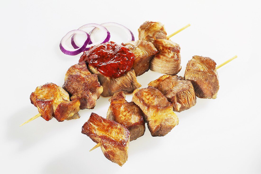 Gyros meat on skewers with sauce