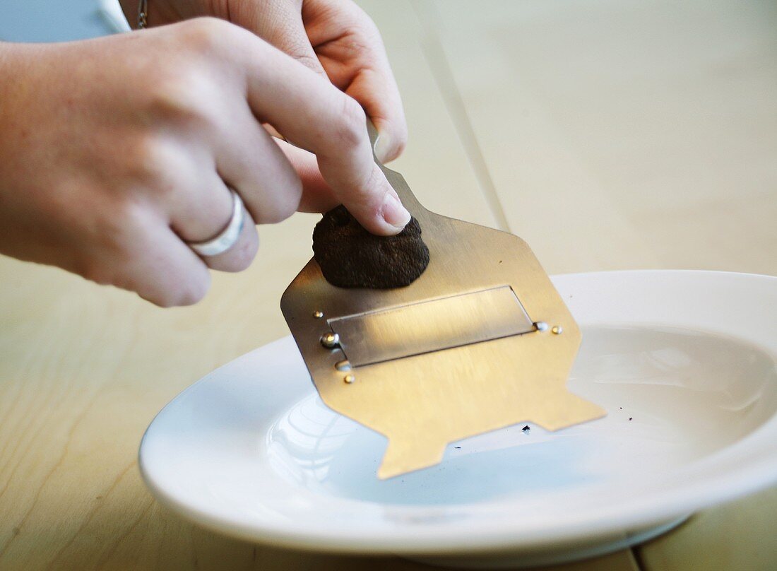 Slicing a black truffle