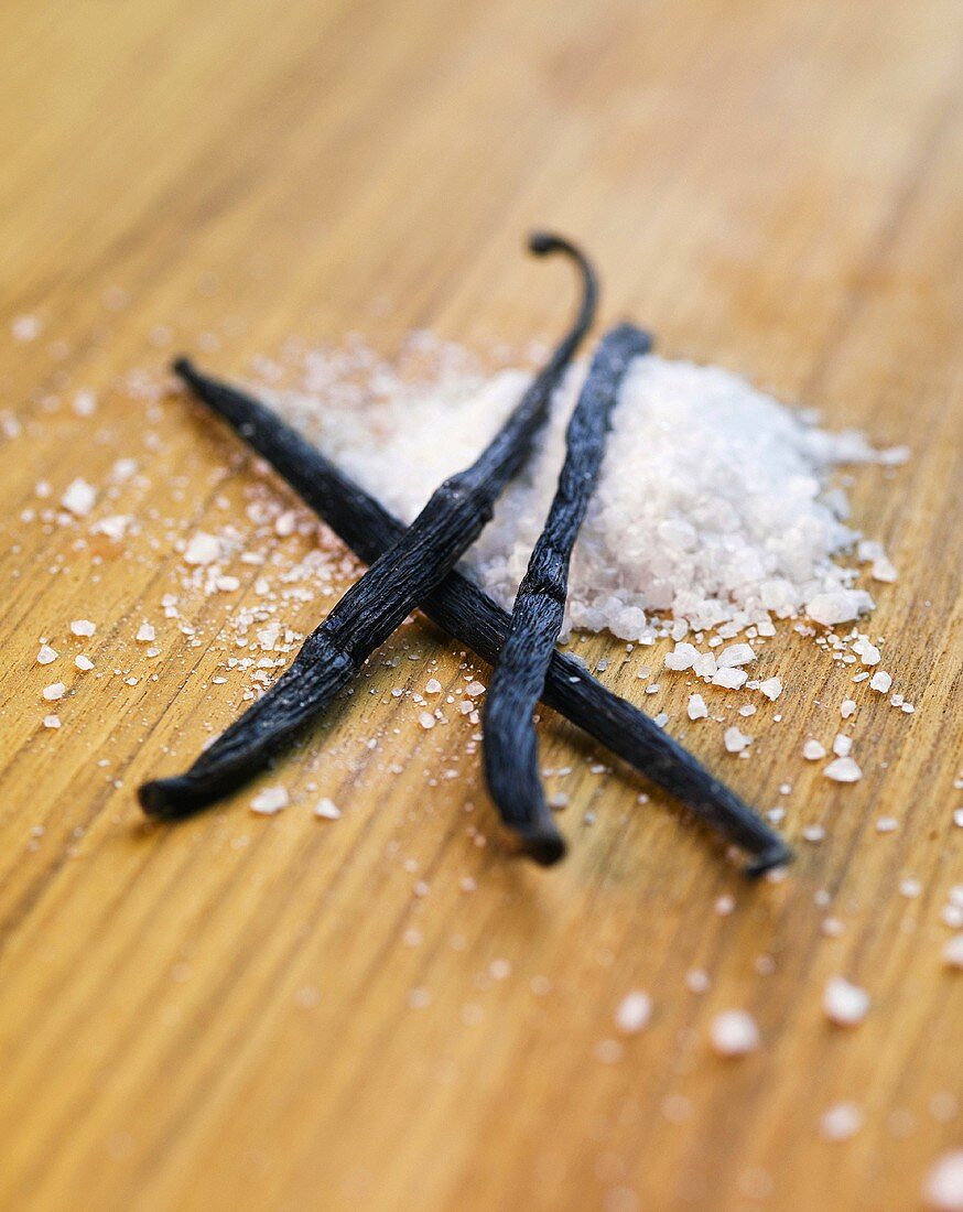 Vanilla pods on wooden background