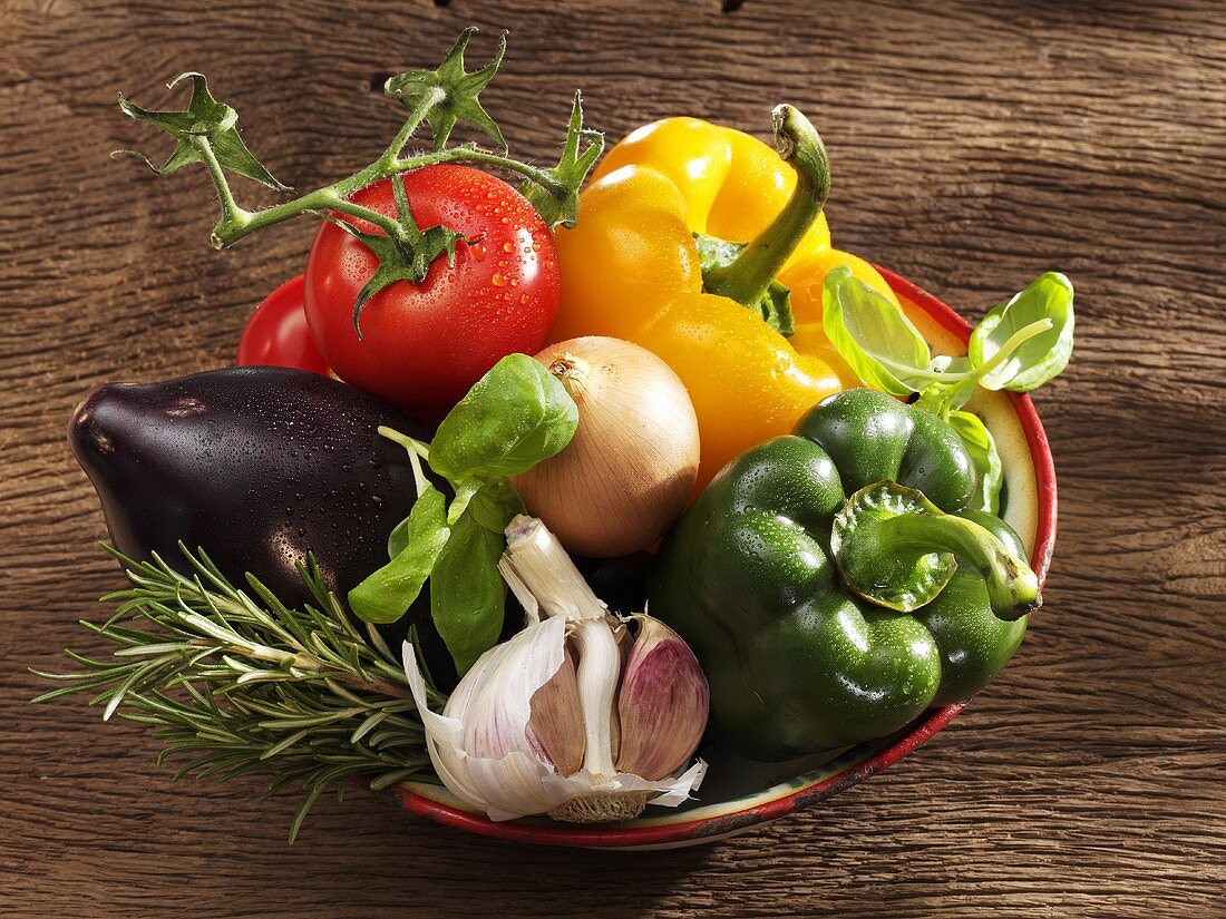 Fresh vegetables and herbs (ingredients for ratatouille)
