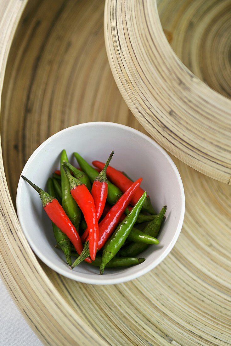 Green and red chillies in a dish