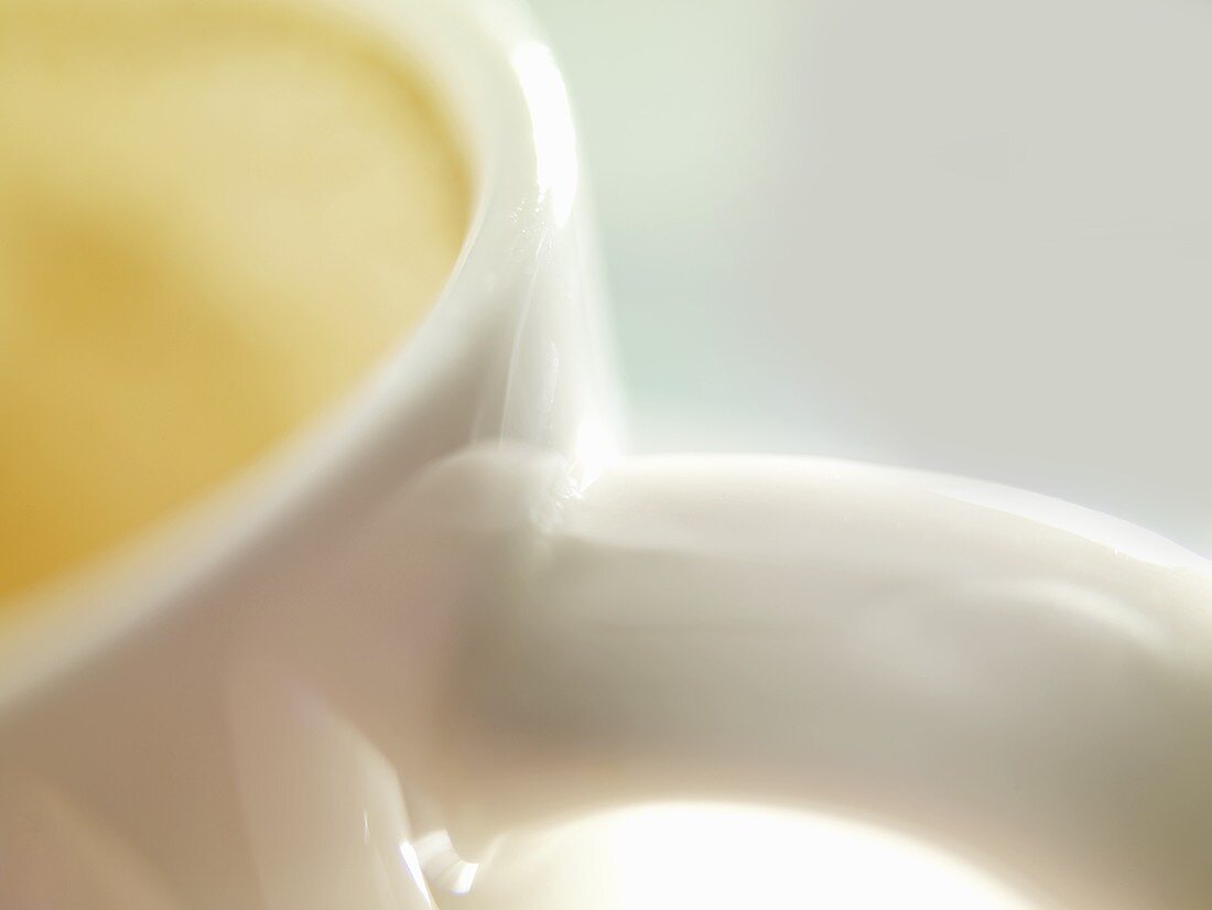 A cup of milky coffee (close-up)