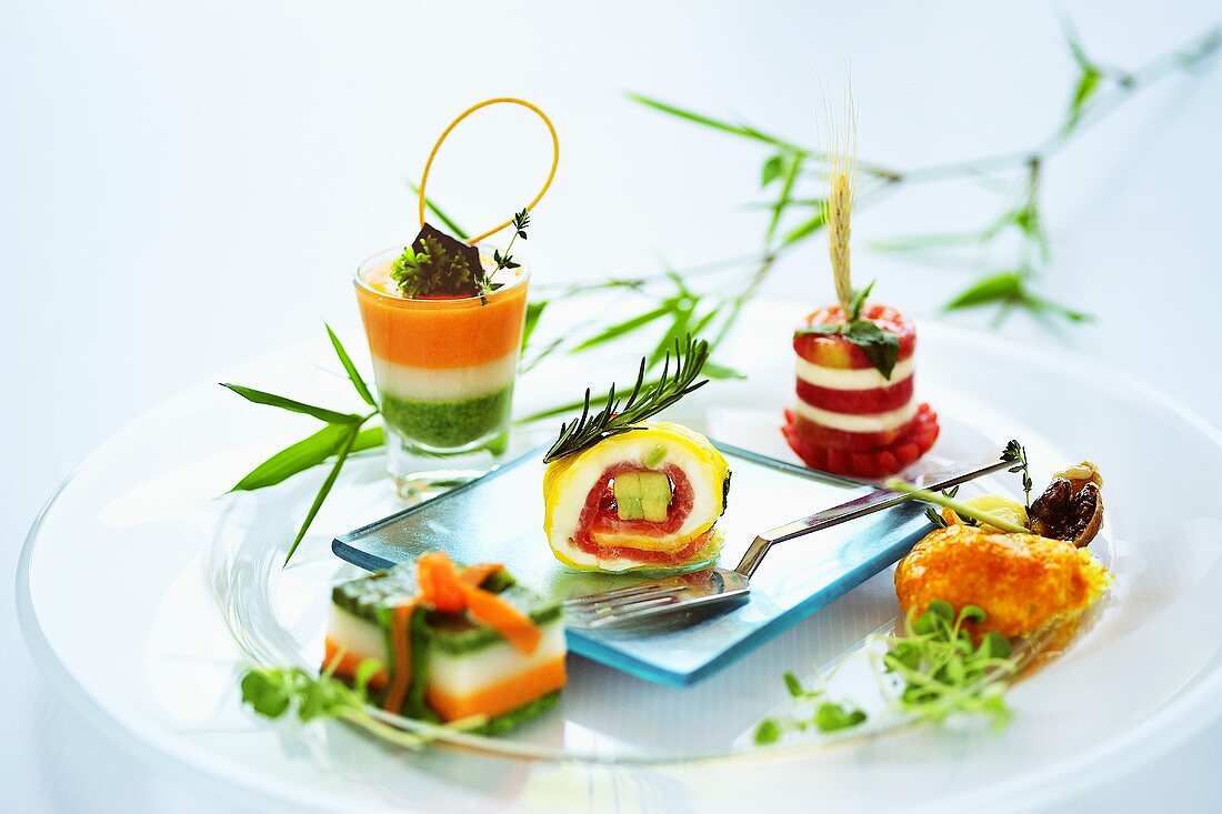 Assorted small seafood appetisers on plate