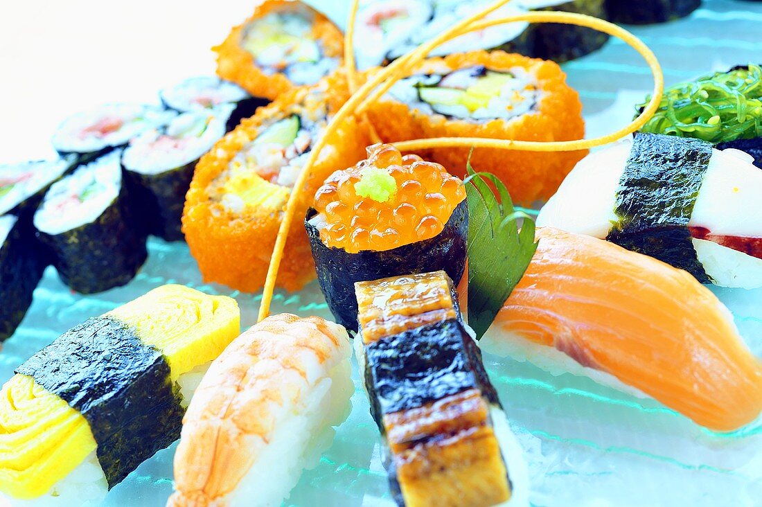 Assorted sushi on a glass plate