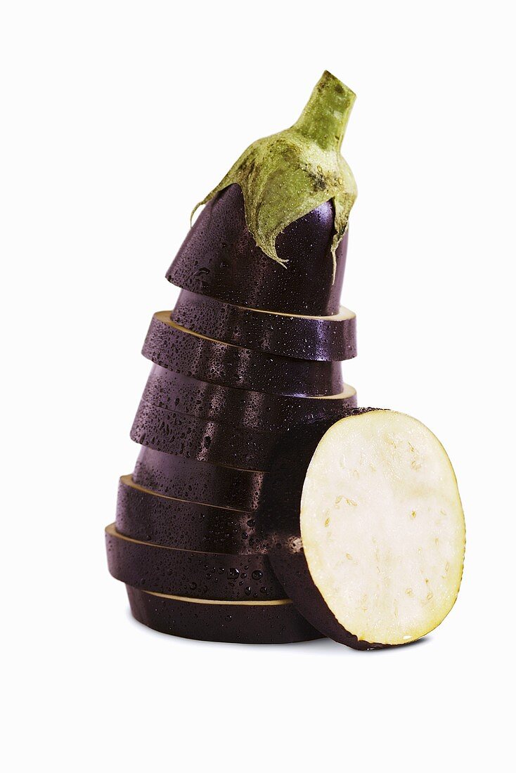 Sliced and Stacked Eggplant on White Background