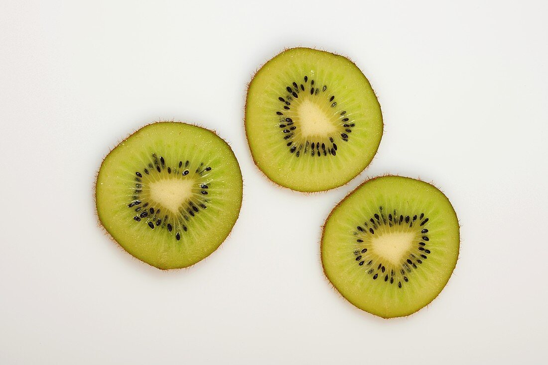 Three slices of kiwi fruit