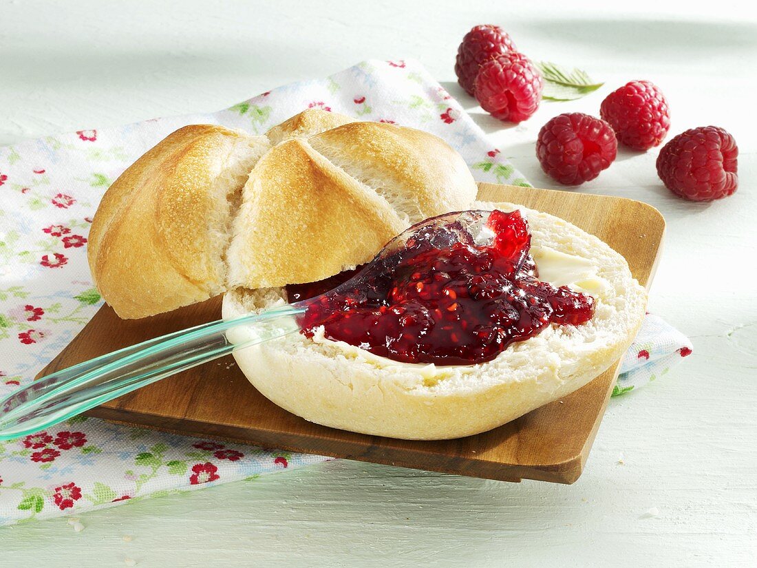 Bread roll with raspberry jam