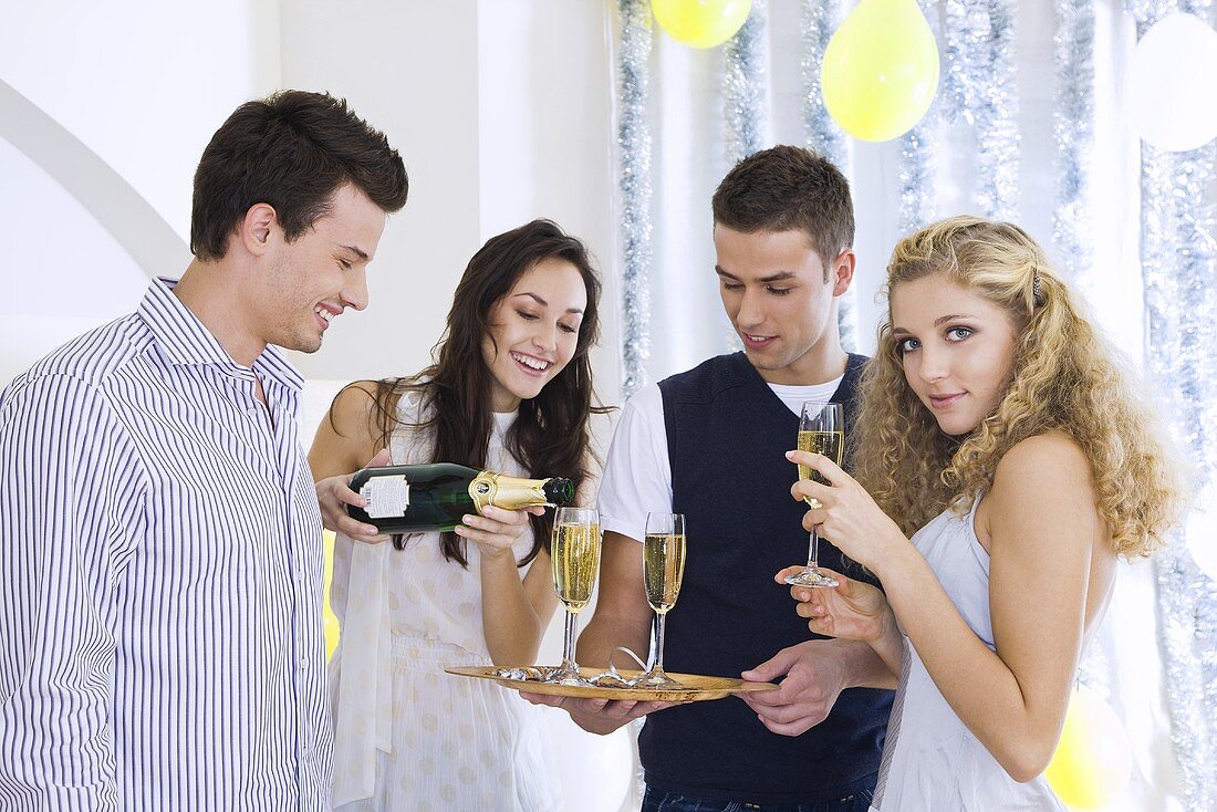 Young people drinking champagne at a party
