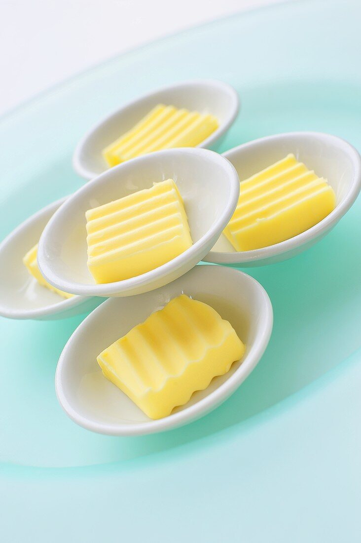 Portions of butter in small dishes
