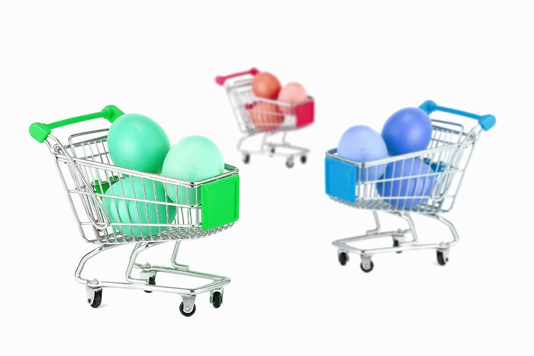 Easter eggs in miniature shopping trolleys