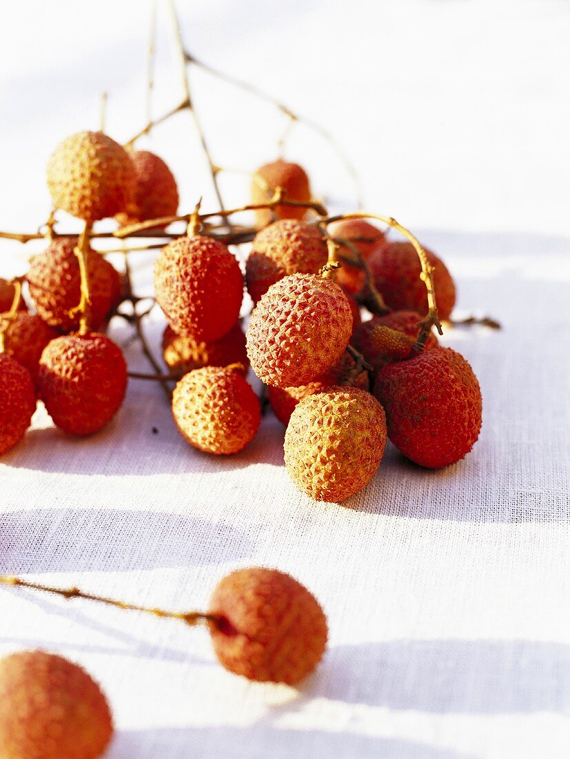Lychees on white fabric