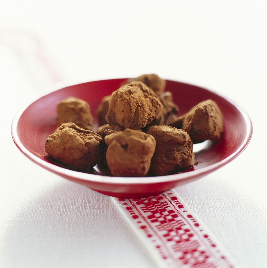 Chocolate truffles in red dish