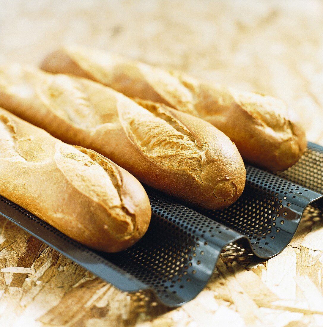 Three freshly baked baguettes